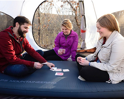 Campers relaxing inside a rented shelter